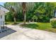 Backyard area featuring tropical plants and an outdoor seating area perfect for entertaining at 4939 Ashby Ave, North Charleston, SC 29405