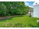 A view of the lush and well-maintained backyard with a glimpse of a patio set at 4939 Ashby Ave, North Charleston, SC 29405