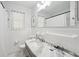 Well-lit bathroom with a marble countertop, a large mirror, and ample counter space at 4939 Ashby Ave, North Charleston, SC 29405