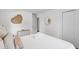 Minimalist bedroom with a heart decoration, light walls, and a neatly made bed with soft pillows at 4939 Ashby Ave, North Charleston, SC 29405