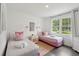 Cozy bedroom featuring two twin beds, matching pillows, and bright natural light at 4939 Ashby Ave, North Charleston, SC 29405