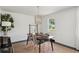 Dining room with modern table setting, stylish chairs, a jute rug, and a decorative light fixture at 4939 Ashby Ave, North Charleston, SC 29405