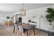 Open-concept dining area with a modern table setting, seamlessly connected to other living spaces at 4939 Ashby Ave, North Charleston, SC 29405
