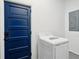 Laundry room featuring new appliances, a blue door, and a clean, functional space at 4939 Ashby Ave, North Charleston, SC 29405