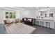 Open-concept living room leading to the kitchen, featuring stylish decor and ample natural light at 4939 Ashby Ave, North Charleston, SC 29405