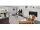Spacious living room with fireplace, comfortable seating and hardwood floors at 4939 Ashby Ave, North Charleston, SC 29405