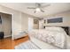 Spacious bedroom featuring a bed with a decorative blanket, hardwood floors, and neutral paint at 507 Stinson Dr # B3, Charleston, SC 29407