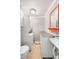 Efficient laundry area with white stackable washer and dryer, and utility sink at 507 Stinson Dr # B3, Charleston, SC 29407