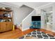 Cozy living room with hardwood floors, staircase and a turquoise console table at 507 Stinson Dr # B3, Charleston, SC 29407