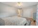 A bright bedroom with wood floors, a ceiling fan, and a large closet at 516 Arlington Dr # B4, Charleston, SC 29414