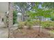 Brick apartment building showcasing mature landscaping, walkways and access to the upper units at 516 Arlington Dr # B4, Charleston, SC 29414