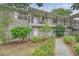 Brick apartment complex with mature landscaping, walkways and second-story balconies at 516 Arlington Dr # B4, Charleston, SC 29414