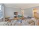 Cozy living room featuring ample seating, a media center, and a view of the adjacent kitchen at 516 Arlington Dr # B4, Charleston, SC 29414