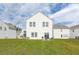 Large backyard featuring a well-maintained lawn and outdoor seating area at 519 Purple Finch Rd, Summerville, SC 29486
