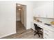 Well-lit home office nook featuring built-in cabinets and a sleek workspace at 519 Purple Finch Rd, Summerville, SC 29486