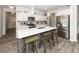Modern kitchen featuring white cabinets, quartz countertops, and stainless steel appliances at 519 Purple Finch Rd, Summerville, SC 29486