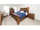 Comfortable main bedroom with a wooden bed frame, dresser, and bedside tables at 519 Purple Finch Rd, Summerville, SC 29486
