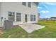 A small concrete patio and well-maintained backyard, ideal for outdoor enjoyment at 523 Purple Finch Rd, Summerville, SC 29486