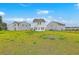 Large backyard perfect for outdoor activities and entertaining under the beautiful blue sky at 523 Purple Finch Rd, Summerville, SC 29486