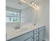 Well-lit bathroom with a double sink vanity, modern fixtures, and a large mirror to simplify busy mornings at 523 Purple Finch Rd, Summerville, SC 29486