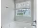 Bright bathroom showing a relaxing bathtub and window with scenic outdoor views at 523 Purple Finch Rd, Summerville, SC 29486
