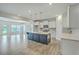Open-concept kitchen boasts a large island, stainless steel appliances, and seamless connection to the dining area at 523 Purple Finch Rd, Summerville, SC 29486