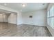 Open-concept living room with modern gray floors and neutral walls, perfect for entertaining guests at 523 Purple Finch Rd, Summerville, SC 29486
