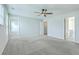 Spacious main bedroom with light-filled windows and a ceiling fan, perfect for relaxing and unwinding at 523 Purple Finch Rd, Summerville, SC 29486
