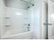 Clean and modern shower-tub combination with white tile surround and new fixtures at 523 Purple Finch Rd, Summerville, SC 29486