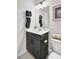 Bathroom featuring a dark vanity with a white countertop, a mirror and a toilet with toiletries at 5541 Alpine Dr, Summerville, SC 29483