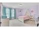 Cozy bedroom with lavender walls, blue curtains, carpet, and a bed featuring a sheer canopy at 5541 Alpine Dr, Summerville, SC 29483