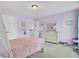 Calming bedroom with lavender walls, carpet, and a dresser with decorative mirror at 5541 Alpine Dr, Summerville, SC 29483