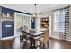 Elegant dining room with natural light, hardwood floors, and stylish decor at 5541 Alpine Dr, Summerville, SC 29483