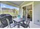Screened lanai provides ample space for dining and relaxation with views of the backyard at 5541 Alpine Dr, Summerville, SC 29483