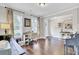 Bright living room with a work station, hardwood floors, and neutral colors, creating a versatile space at 5541 Alpine Dr, Summerville, SC 29483