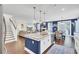 Open living space with kitchen island, stainless appliances, dining area, and living room at 5541 Alpine Dr, Summerville, SC 29483