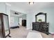 A spacious bedroom featuring elegant furniture, soft lighting, and doorway to additional rooms at 5541 Alpine Dr, Summerville, SC 29483