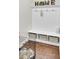 Charming mudroom with built-in storage, wood floors, and modern accents creating an organized entryway at 5541 Alpine Dr, Summerville, SC 29483