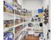 Well-organized pantry with white wire shelving, ample storage, and hardwood floors at 5541 Alpine Dr, Summerville, SC 29483