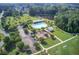 Aerial view of community amenities including a pool, playground, parking, and green space perfect for recreation at 596 Wayton Cir, Moncks Corner, SC 29461