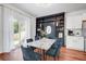 Well-designed dining room featuring a stylish table, attractive chairs, and a decorative built-in bookcase at 596 Wayton Cir, Moncks Corner, SC 29461