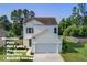 Two-story home featuring white siding, a two car garage, and manicured landscaping in a community with great amenities at 596 Wayton Cir, Moncks Corner, SC 29461