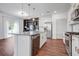 Open-concept kitchen featuring granite countertops, stainless steel appliances, and a spacious island for food preparation at 596 Wayton Cir, Moncks Corner, SC 29461