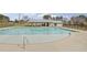 Community pool with a zero entry, and a cabana-style gathering place, all behind a black metal fence at 596 Wayton Cir, Moncks Corner, SC 29461
