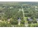 An aerial view of the property nestled within a verdant neighborhood with a dense tree coverage and community at 800 Enclave Ter, Summerville, SC 29483