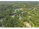 An aerial view of the property showing lush tree coverage and neighborhood, including solar panels on the roof at 800 Enclave Ter, Summerville, SC 29483
