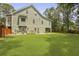 Large backyard with lush lawn and mature trees, providing ample space for outdoor activities and privacy at 800 Enclave Ter, Summerville, SC 29483