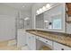 Bathroom featuring granite counters, dual sinks, and a walk-in shower with a glass enclosure at 800 Enclave Ter, Summerville, SC 29483