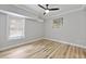 Neutral-toned bedroom with hardwood floors, ceiling fan and bright window at 800 Enclave Ter, Summerville, SC 29483