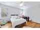Bright bedroom with hardwood floors, white walls, and natural light from two windows at 800 Enclave Ter, Summerville, SC 29483